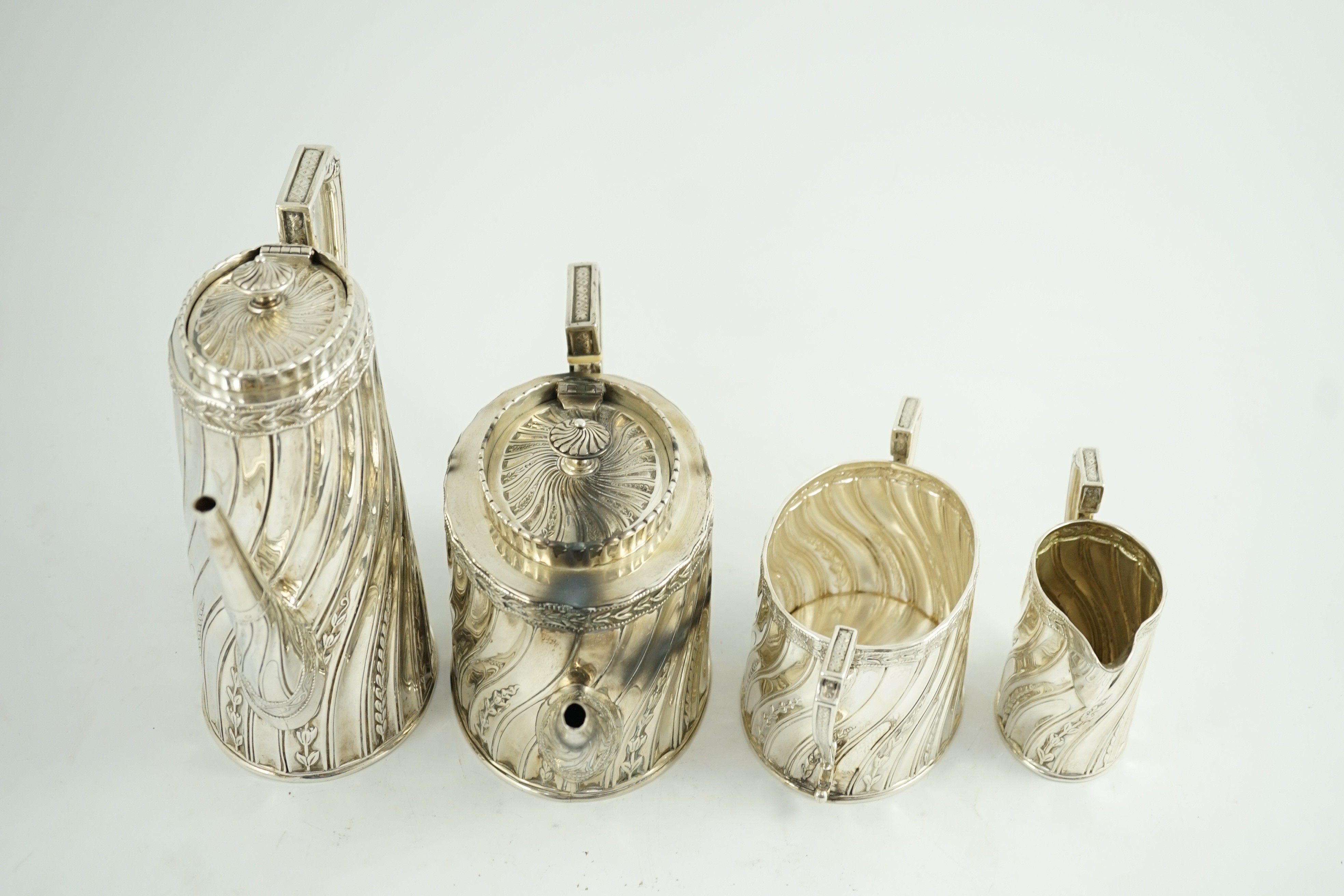 A late Victorian silver four tea and coffee service, by Walter & John Barnard